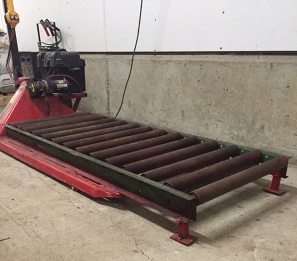A winch and roller system on a pallet lifter makes it easier to move dead animals.