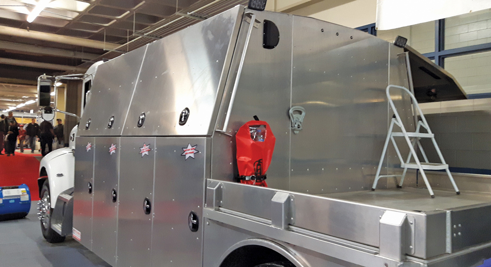 The companies jointly displaying this fully-equipped service rig say they can custom design a vehicle to meet specific producer needs.