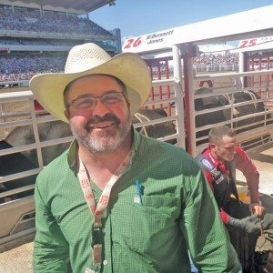man wearing cowboy hat at a rodeo