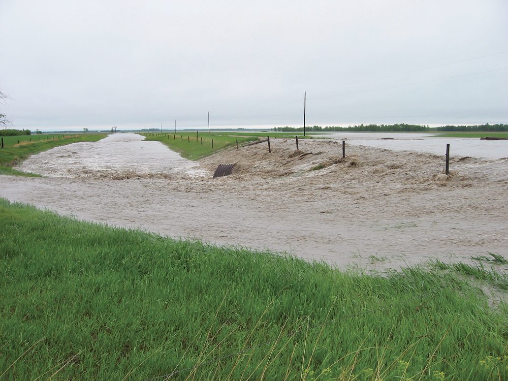 Heavy rain in the Manitoba Escarpment in June 2002 caused flash flooding just west of Miami, Man. Removing natural areas from the escarpment allows water to flow more quickly to the lowlands below.