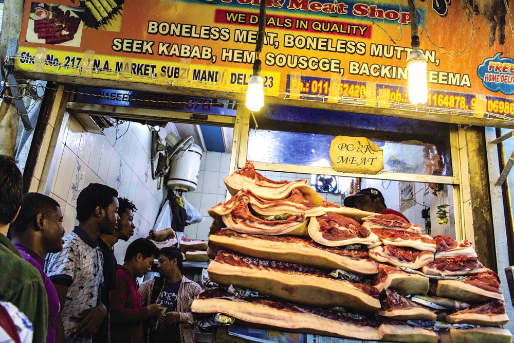 Even though much of the country is Hindu or Muslim, food analysts forecast a big jump in pork sales.