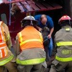 horses being rescued from an overturned trailer