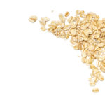 Dry rolled oatmeal on white background - isolated