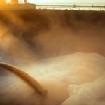 wheat being loaded onto a bulk vessel at port in Russia.