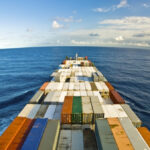 The front of a cargo ship at sea.