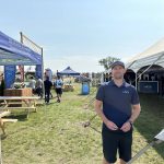 Kyle Gibson of AGI3 outside his company's booth at Ag in Motion. Photo: Don Norman