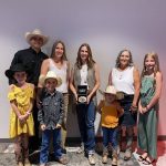 Cassie Marchand poses with the family of the late Reg Schellenberg