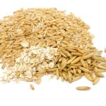 a pile of cereal grains on a white background