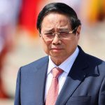 Vietnamese Prime Minister Pham Minh Chinh waits for Chinese President Xi Jinping to arrive before his departure, following his visit to Hanoi at Noi Bai International Airport in Vietnam, April 15, 2025.