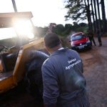 A man cleans a tractor at a sanitary barrier, after Brazil confirmed its first outbreak of bird flu on Friday, triggering protocols for a country-wide trade ban from top buyer China and state-wide restrictions for other major consumers, in Montenegro, Brazil
