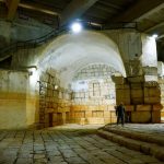 A man walks in an empty Ein al-Fejeh spring basin, in Damascus countryside, Syria, May 12, 2025.