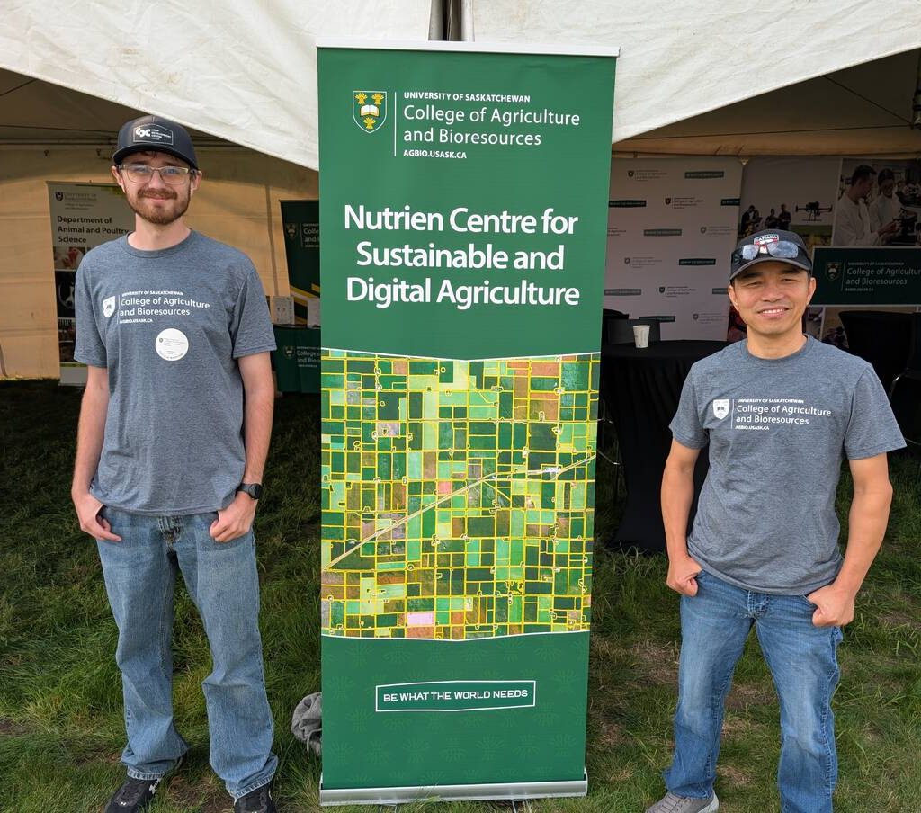 Research Officer Tuan Ha and summer lab student Shawn Neudorf at the University of Saskatchewan's booth at Ag in Motion 2025. Photo by Jonah Grignon