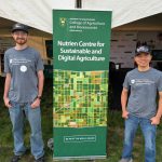 Research Officer Tuan Ha and summer lab student Shawn Neudorf at the University of Saskatchewan's booth at Ag in Motion 2025. Photo by Jonah Grignon