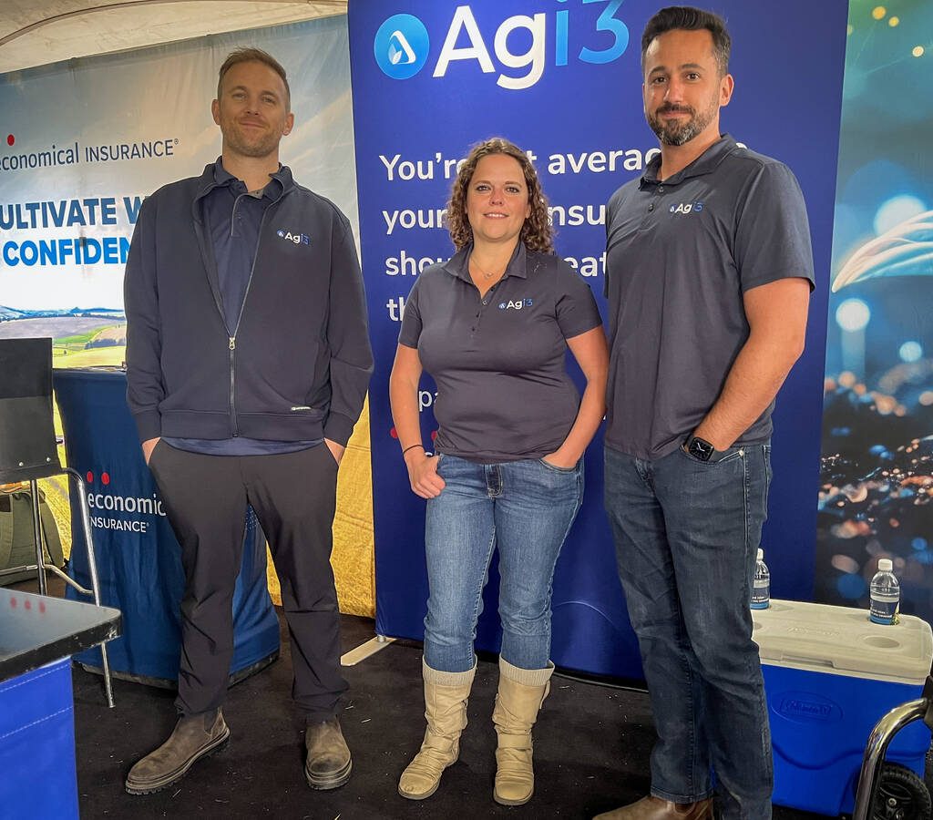 (Left to Right) Kyle Gibson, Sharene Cunningham and Paul Munro stand at Agi3's booth at Agriculture in Motion on July 15, 2025. Photo: Geralyn Wichers