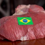 Raw beef with a brazil flag label on it.