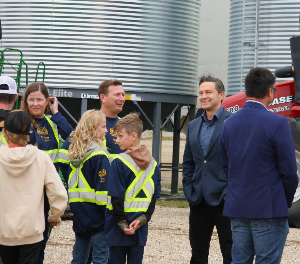 Pierre Poilievre at Sixteen Grains near Saskatoon, Sask. speaking to one of the farm owners. Photo: Janelle Rudolph