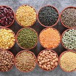 bowls of assorted lentils, beans, peas and other pulses.