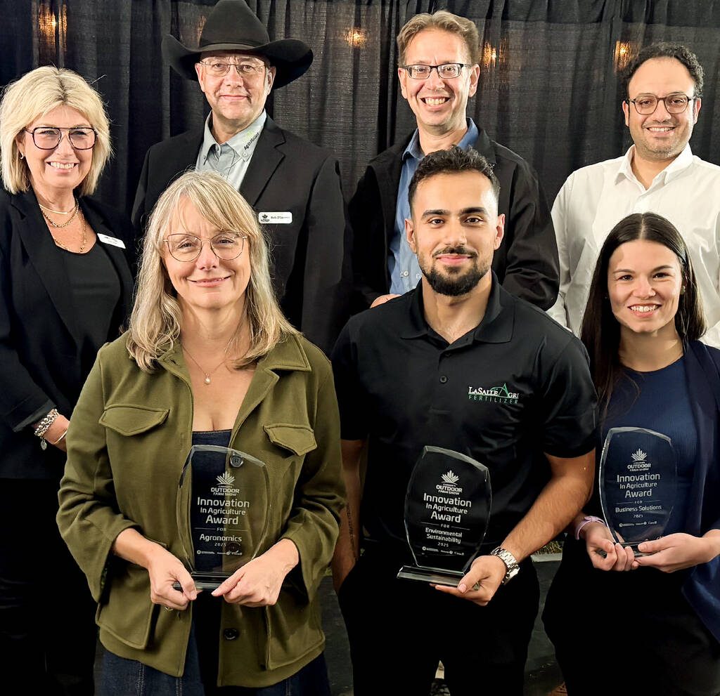 Donna Boyd, Agricultural Manufacturers of Canada president, back left, and Canada’s Outdoor Farm Show’s man in black, Rob O’Connor, show director, emceed the Innovation Program Awards on Sept. 8, 2025, the night before the Farm Show opened. Chuck Baresich, Haggarty AgRobotics founder, back centre, won in the Equipment category. Behnam Abbasian, BioFerScience, back right, won in the Livestock category. Kristine White, Spornado CEO and co-founder, front left, took home the Agronomics award. LaSalle Agri Inc., Marketing Coordinator Amin Phoenix, accepted the Environmental Sustainability award, and Bruna Mion, Lactanet dairy production expert, captured the Business Solutions award.