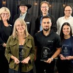 Donna Boyd, Agricultural Manufacturers of Canada president, back left, and Canada’s Outdoor Farm Show’s man in black, Rob O’Connor, show director, emceed the Innovation Program Awards on Sept. 8, 2025, the night before the Farm Show opened. Chuck Baresich, Haggarty AgRobotics founder, back centre, won in the Equipment category. Behnam Abbasian, BioFerScience, back right, won in the Livestock category. Kristine White, Spornado CEO and co-founder, front left, took home the Agronomics award. LaSalle Agri Inc., Marketing Coordinator Amin Phoenix, accepted the Environmental Sustainability award, and Bruna Mion, Lactanet dairy production expert, captured the Business Solutions award.