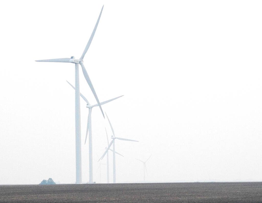 Windmills in central Manitoba disappear into heavy smoke June 9, 2025. Wildfires in Manitoba and across Western Canada led to widespread air quality warnings through May and June 2025. Photo: Alexis Stockford