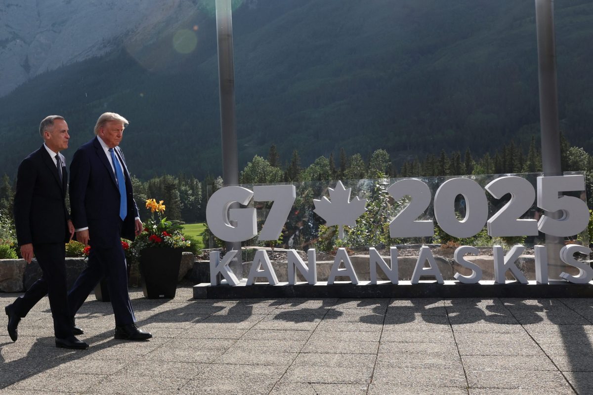 Canada's Prime Minister Mark Carney and U.S. President Donald Trump leave after an outdoor family photo session during the G7 Summit, in Kananaskis, Alberta, Canada.