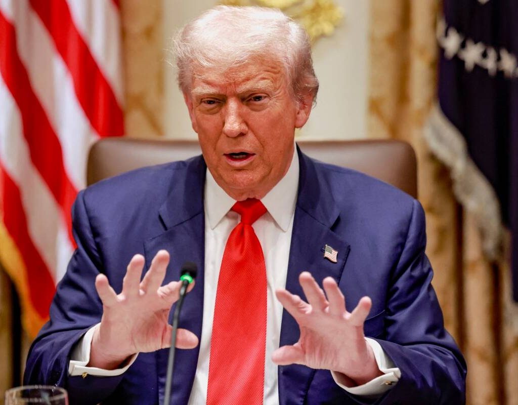 U.S. President Donald Trump gestures as he speaks during lunch with Argentina’s President Javier Milei (not pictured) in the Cabinet Room at the White House in Washington, D.C., U.S., October 14, 2025.