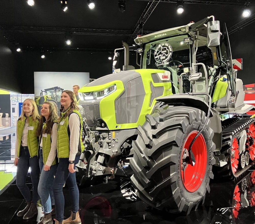 Claas team members pose by the Axion 9.450 Terra Trac tractor at Agritechnica 2025. The tractor was awarded ’Tractor of the Year’ in the HighPower category for 2026.  Photo: Greg Berg