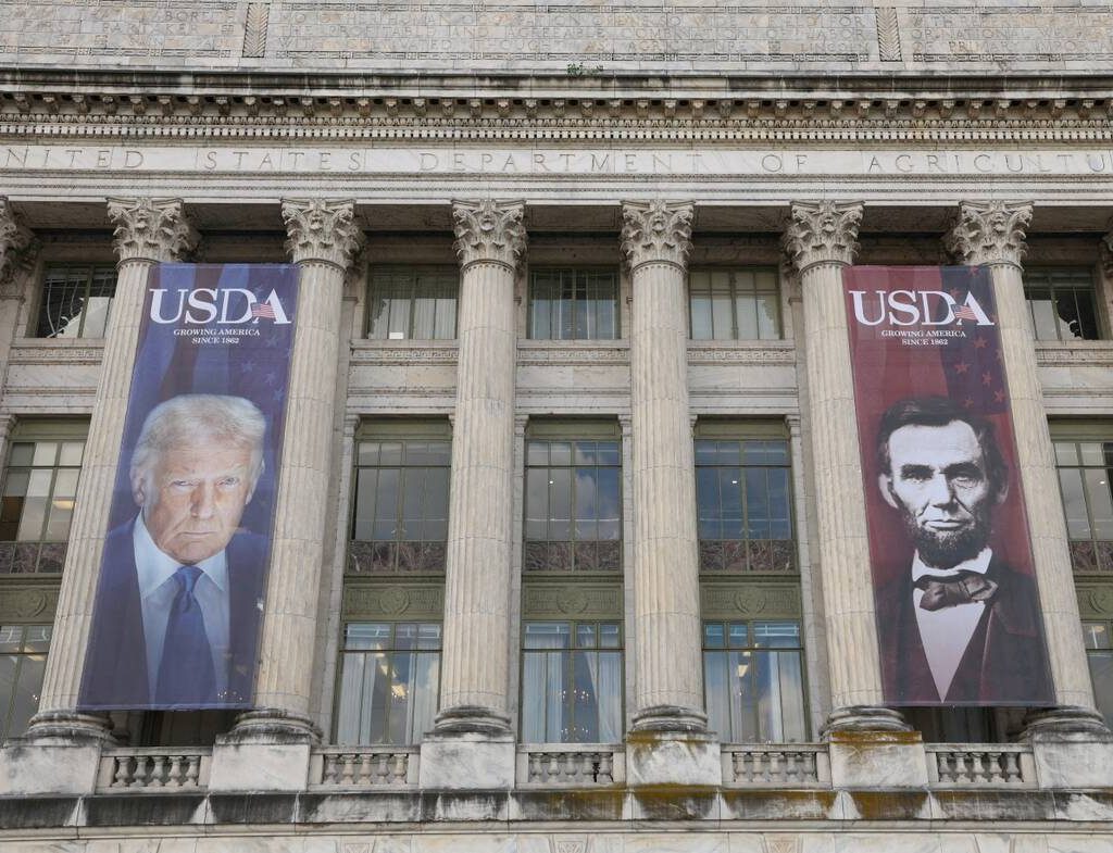 Banners of U.S. President Donald Trump and President Abraham Lincoln reading "Growing America Since 1862" hang over the entrance to the United States Department of Agriculture (USDA) in Washington, D.C., U.S., May 15, 2025. Photo: REUTERS/Kevin Lamarque/File Photo