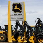 FILE PHOTO: Equipment for sale is seen at a John Deere dealer in Denver May 14, 2015. A weak global agriculture sector weighed heavily on quarterly results posted by Deere & Co on May 22, 2015, but earnings still topped expectations, and the farm equipment maker raised its full-year profit forecast despite a worsening sales outlook. Photo taken May 14, 2015.  REUTERS/Rick Wilking/File Photo