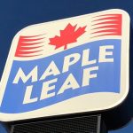Close-up on a Maple Leaf Foods sign.