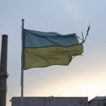 A weathered Ukrainian flag flies in the Podil district of Kyiv, Ukraine. Photo: Getty Images Plus.