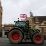 A demonstrator drives a tractor during a protest by UK farmers opposing government inheritance tax reform plans, outside of the Houses of Parliament in London, Britain, December 16, 2025. Photo: REUTERS/Corey Rudy TPX IMAGES OF THE DAY