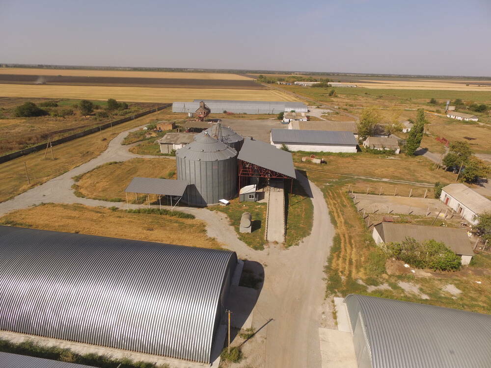 An aerial view of a Ukrainian farm yard and buildings.