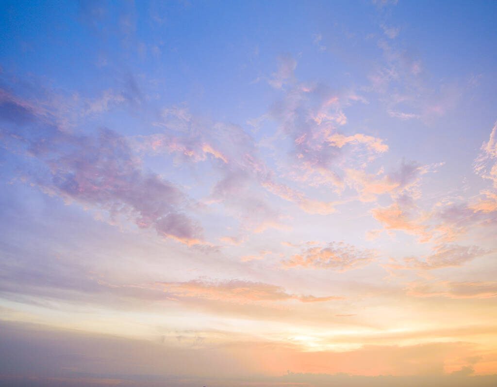 Aerial view of a sunset sky with clouds.