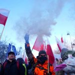 A demonstrator holds a flare as Polish farmers protest against the Mercosur trade deal in front of the Chancellery of the Prime Minister, in Warsaw, Poland, January 9, 2026.