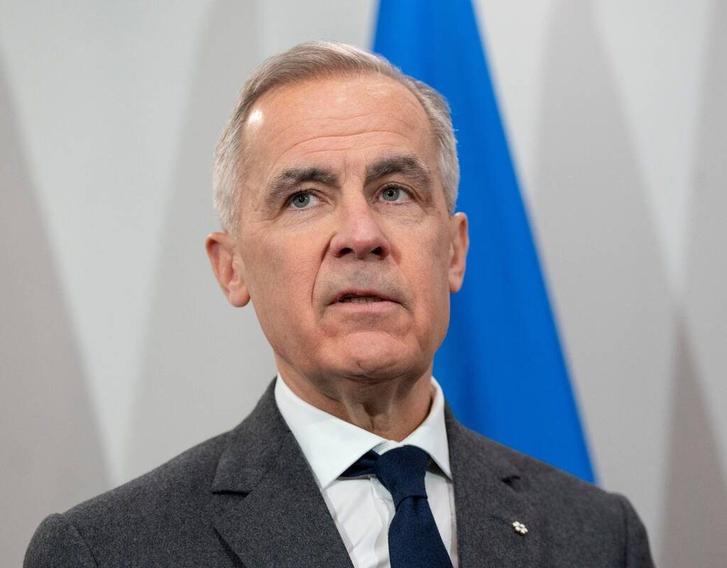 Canada's Prime Minister Mark Carney looks on during his meeting with Ukrainian President Volodymyr Zelenskiy in Halifax, Nova Scotia, Canada, December 27, 2025.