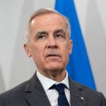 Canada's Prime Minister Mark Carney looks on during his meeting with Ukrainian President Volodymyr Zelenskiy in Halifax, Nova Scotia, Canada, December 27, 2025.