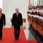 Canada's Prime Minister Mark Carney and China's Premier Li Qiang review the honour guard at an official welcoming ceremony, during the first visit by a Canadian prime minister to China since 2017, at the Great Hall of the People in Beijing, China