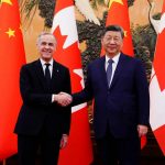Canadian Prime Minister Mark Carney shakes hands with President of China Xi Jinping at the Great Hall of the People in Beijing, China on Friday, Jan. 16, 2026.