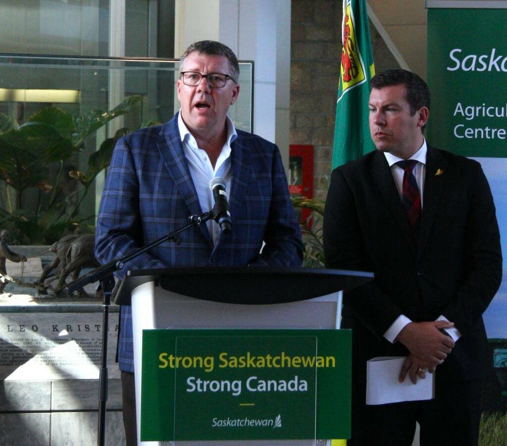 Saskatchewan premier Scott Moe and Kody Blois speak to media in August.