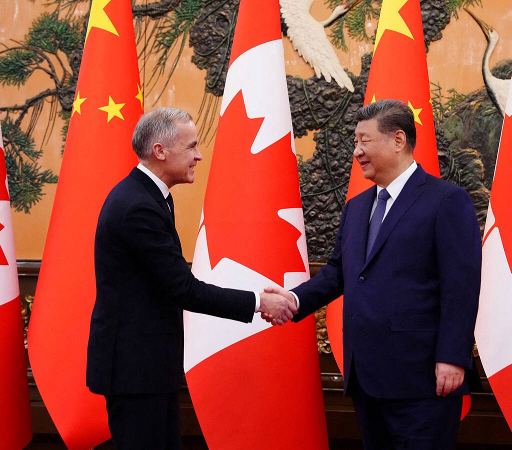 Canadian Prime Minister Mark Carney shakes hands with President of China Xi Jinping at the Great Hall of the People in Beijing, China on Friday, Jan. 16, 2026.  Sean Kilpatrick/Pool via REUTERS