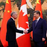 Canadian Prime Minister Mark Carney shakes hands with President of China Xi Jinping at the Great Hall of the People in Beijing, China on Friday, Jan. 16, 2026.