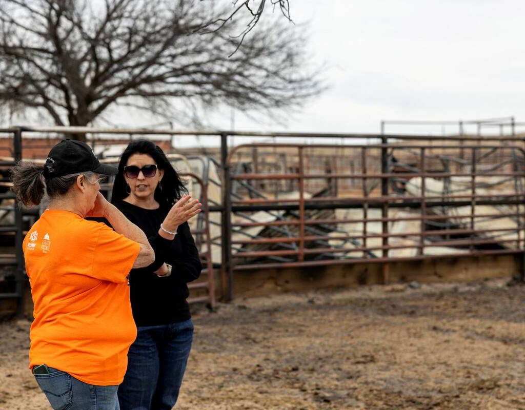 Oklahoma Secretary of Agriculture, Food and Forestry Blayne Arthur speaks with a rancher after intense wildfires, during a visit to northwest Oklahoma February 18, 2026. Photo: Oklahoma Department of Agriculture, Food and Forestry/Handout via REUTERS.