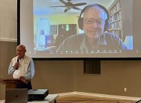 Blake Holtman talking with Allan Savory via an online camera at the recent Holistic Management Conference in Taber, Alberta