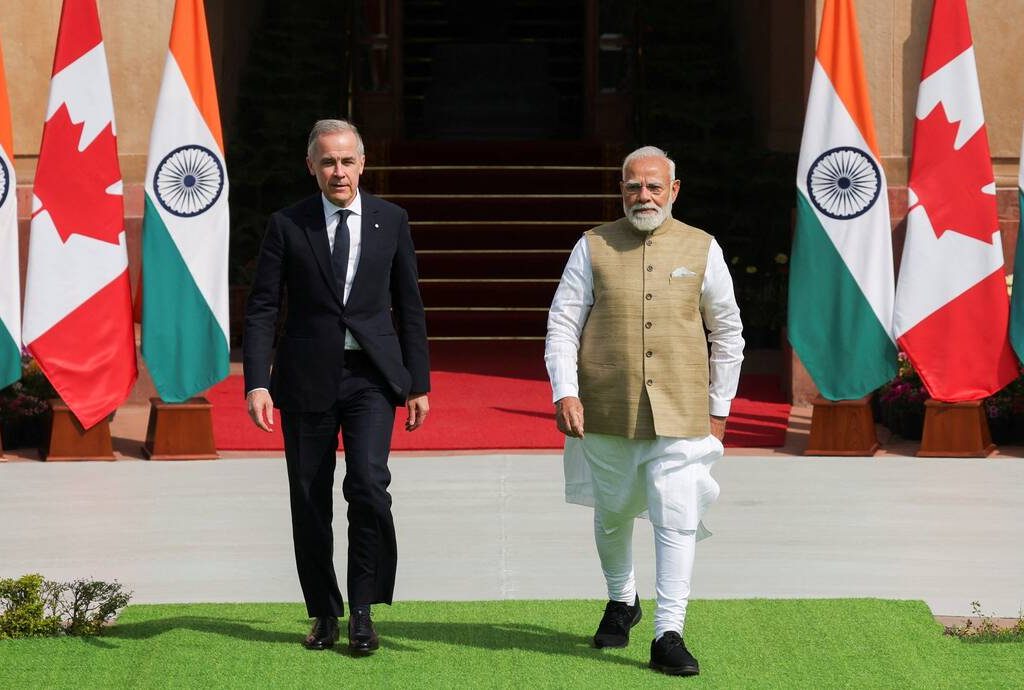 Canada's Prime Minister Mark Carney walks with his Indian counterpart, Narendra Modi, before their meeting at Hyderabad House in New Delhi, India, March 2, 2026. REUTERS/Adnan Abidi