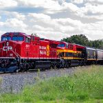 A red CPKC locomotive.
