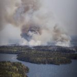 May 14, 2024, Flin Flon, Mb, CANADA: A wildfire burns in northern Manitoba near Flin Flon, as seen from a helicopter surveying the situation, Tuesday, May 14, 2024. (Credit Image:  David Lipnowski/The Canadian Press via ZUMA Press)