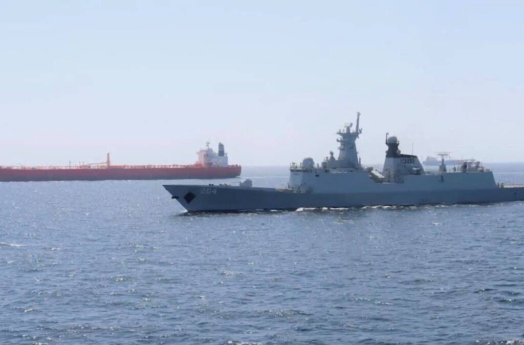 A Pakistan Navy ship escorts a Pakistani merchant vessel, as part of a maritime security operation, named Muhafiz-ul-Bahr, as regional tensions threaten key sea routes, amid the U.S.-Israeli conflict with Iran, at an unidentified location, released March 9, 2026, in this screen grab taken from a handout video. Photo: ISPR/Handout via REUTERS