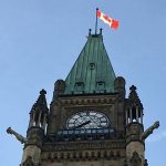 A Canadian flag flies at the top of one of the Parliament buildings in Ottawa. Photo: File