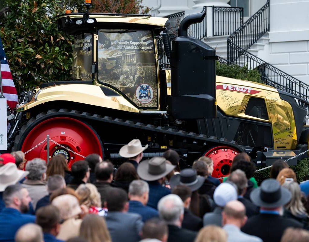 A golden farming tractor featuring the signatures of Trump Administration cabinet members is displayed during an event celebrating farmers and Agriculture Day on the South Lawn of the White House in Washington DC on Friday, March 27, 2026.